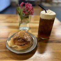 Cinnamon bun, iced coffee with cold foam  at Sevens in Buffalo