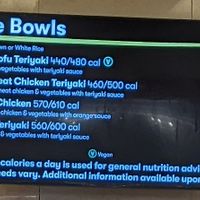 Grilled Tofu Teriyaki bowl—clearly marked vegan—at the top of the menu of the Asian kitchen in the food court at Whole Foods Market - Fort Apache in Las Vegas