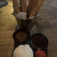 Churros with hazelnut and chocolate sauces and house made vanilla ice cream   at Brother Bon in Northcote