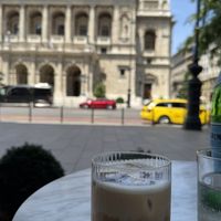 Iced soy cappuccino and a wonderful view of the opera  at Le Petit Beefbar Budapest in Budapest