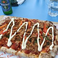 "Tulisonni" spicy tomato sauce, vegan cheese, seitan, parsley, aioli, bell pepper. at Uuno Herttoniemi in Helsinki