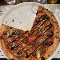 Pizza with some beans and vegan Parmesan, I would recommend this one   at Ideolo Pizza in Szczecin