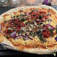 Geneva pizza with meat removed and vegan cheese added   at The Bulls Head East Leake in England