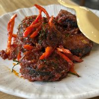 Stir fried plant based “cat fish” with red curryy  at Sukjai by Pata Obasan in Chiang Mai