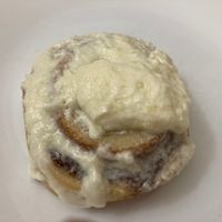 Plain bun with cream topping, plated at home (the cream topping got a bit mushed in tranportation) at Cinnaholic in New York City