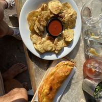 Fried zucchini with the tomato sauce from the  pizza and a delicious garlic flat bread   at Ресторант ВКЪЩИ in Varna