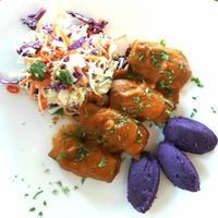 King oyster BBQ ribs, purple sweet potato mash, Thai salad at Santosa Vegan Restaurant in Phuket