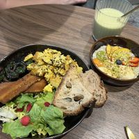 Breakfast plate with matcha latte, chia pudding, and tofu scramble. 🐛🍵  at Lundi au soleil  in Annecy
