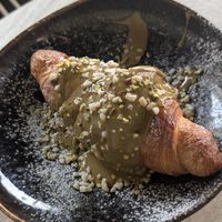 Croissant topped with pistachio sauce at Lundi au soleil  in Annecy