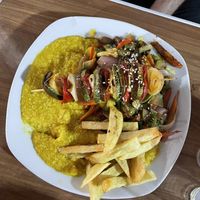 Pumpkin quinoa risotto with vegetable skewer & fries  at Vegan Point in Cusco