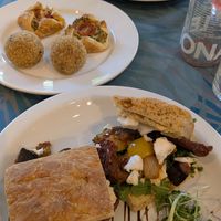 Mediterranean focaccia, arancini balls and savoury pastries (almond feta, spinach and tomato tart) at Planted Community Cafe, Refillery and Hub in Cheltenham