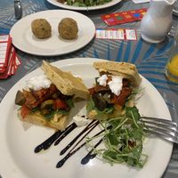 Vegan focaccia, Lebanese flat bread & aranchini balls   at Planted Community Cafe, Refillery and Hub in Cheltenham