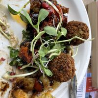 The Lebanese falafel flatbread (half eaten)  at Planted Community Cafe, Refillery and Hub in Cheltenham