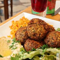 falafel salad, served with hummus and tabbouleh. at Chez Funda - Le Village  in Paris