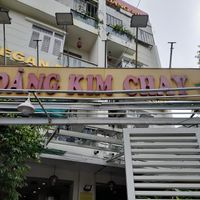 Old faded sign at the front at Cơm Chay Hoàng Kim in Ho Chi Minh City