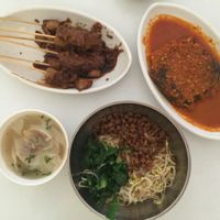 mi Pangsit- great noodles+ dumplings that is not spicy. Assam chilli fish had a weird taste - tastes like tofu but more processed taste. satay is fantastic  at Loving Hut in Denpasar