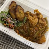 jamaican red curry with plantains and salad  at WorldBeat Cafe in San Diego