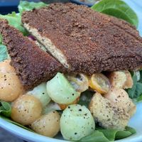 Melon ball salad with fried miso tofu. Made vegan by holding the mozzarella. at Heart of Gold in Cleveland