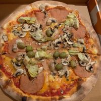 Photo doesn’t make it justice - always delicious pizzas and perfect dough! at Pizza Pinocchio in Vienna