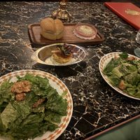 Caesar salad, crab cake, rolls   at Vulture in San Diego
