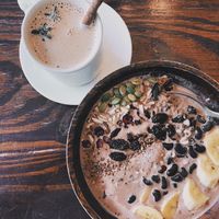 Chai latte with almond milk & Banana Cacao Quinoa Porridge. Super satiating?  at Mango in Bangkok