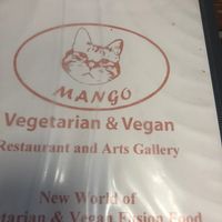 The menu cover which includes a drawing of a cat since there are plenty of cats lounging around inside at Mango in Bangkok