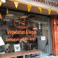 Exterior shot with cute artwork on the walls  at Mango in Bangkok