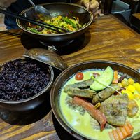 Banana green curry, black rice, and Kung Pao zoodles... Amazing flavors! at Mango in Bangkok
