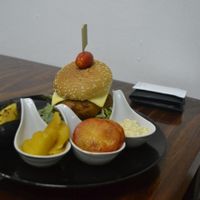 my friend's dish: falafel burgeer. would have been vegan minus the cheese.  at Mango in Bangkok