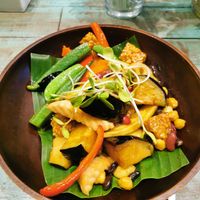 Stir fried tempeh eggplants okras peppers chick pea at Mango in Bangkok