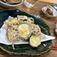 ShoLight, crispy, and completely plant-based.
Seasonal vegetables like lotus root, sweet potato, and shiitake jin style tempura  at Izuho - 民泊 いづほ in Mie