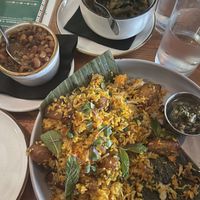 Masala coconut collard greens, vindaloo baked beans, and plantain biryani 🤤   at Grann in Tacoma