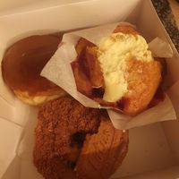 (Top left) Fudge donut. (Top right) Strawberry cheesecake muffin. (Bottom) Biscoff & cinnamon donut. at Coughlans Bakery - Dorking  in Dorking