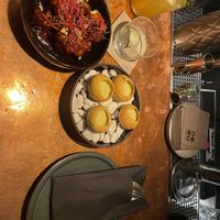 Stuck on you und Continental Crush, crispy pani puri filled with corn and indo-African coconut curry water. Drink is a signature they made to complement the dishes.  at Eat Me in Vaud