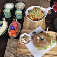 Breakfast, coconut yogurt, fruit, bagels, scrambled tofu, fresh juice and coffee😋  at Green Tiger House in Chiang Mai