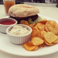 Lush falafel burger with papas criollas chips   at Herbívoro -  Av. Suba in Bogota