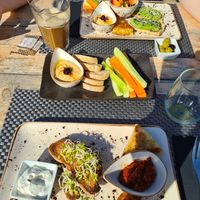 Breakfast. I had "Mallorca" and my partner had "Continental". Ordered extra hummus. at Villa Vegana in Mallorca