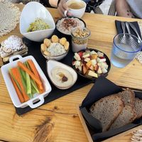 Breakfast including scrambled tofu, hummus, pancakes, oats, yoghurt, granola, fruit salad, fresh baked breadd  at Villa Vegana in Mallorca