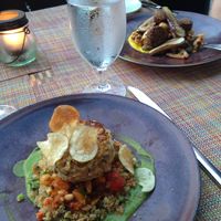 Vegan hearts of palm ";crab cake"; in foreground, eggplant falafel in background at Equinox Restaurant in Washington