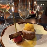 Warm Hawaiian coconut cake with passion fruit coulis, pineapple compote, and raspberry sorbet   at Equinox Restaurant in Washington