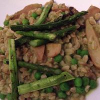Farro risotto with English peas, asparagus and trumpet mushrooms at Equinox Restaurant in Washington