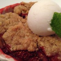Vegan rhubarb strawberry oat crumble with vegan ice cream  at Equinox Restaurant in Washington