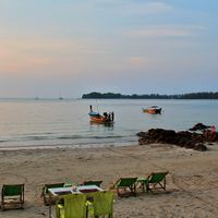 Time for lime has sunchairs and tables on the beach.  at Time for Lime in Koh Lanta