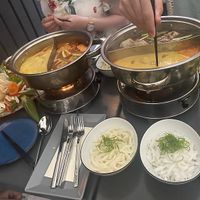 Two hot pots with kokos-curry, pho, and sweet&sour  at Vevi - Kaiserstrasse in Vienna