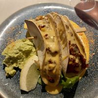 Spicy oven-baked seitan tacos with sheese and guacamole   at Vegan Restoran V in Tallinn