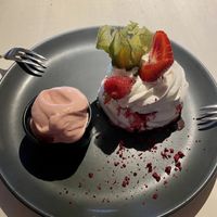 Meringue with passionfruit filling and vegan strawberry ice cream at Vegan Restoran V in Tallinn