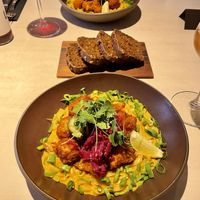 Curry sauce rice noodles with cauliflower fries  at Vegan Restoran V in Tallinn