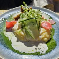 Baked sweet potato with quinoa, crispy tempeh, guacamole and mango sauce at Vegan Restoran V in Tallinn