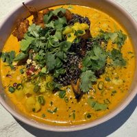  Delicious coconut mango dish with cauliflower, quinoa + sweet potato   at Vegan Restoran V in Tallinn