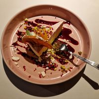 Orange cake and blackcurrant sauce for dessert. at Vegan Restoran V in Tallinn